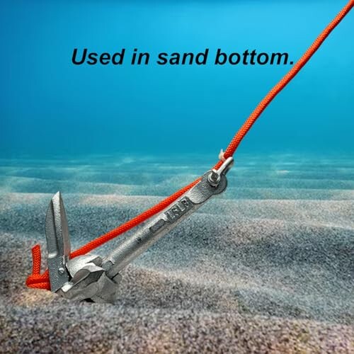 Anchor secured in sandy ocean floor.